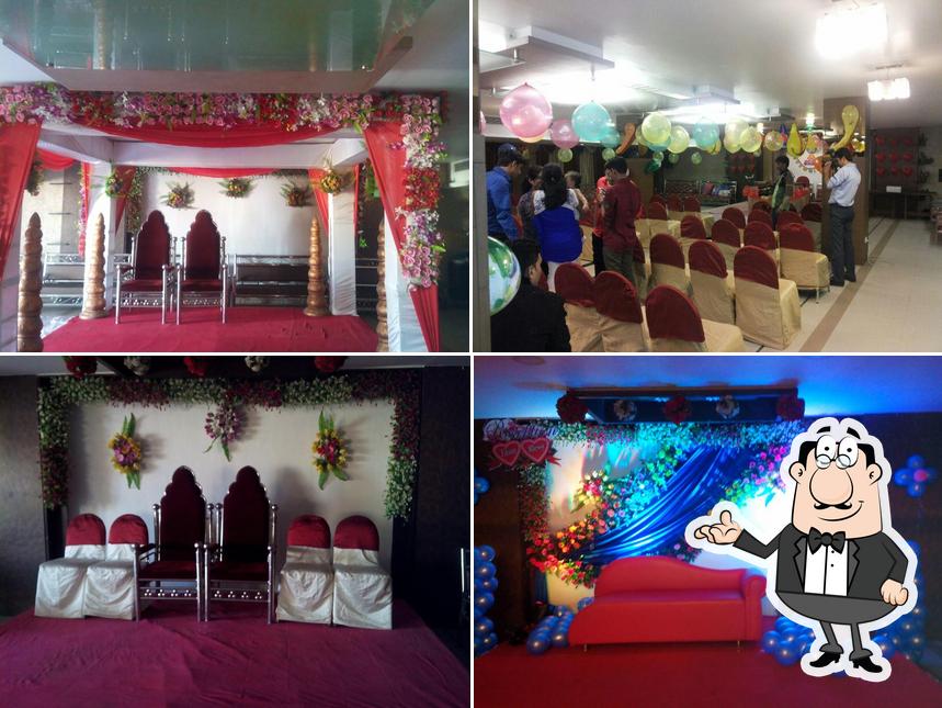 Take a seat at one of the tables at Vhalam Galaxy Restaurant &Banquets, Naroda