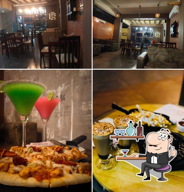 Take a look at the image displaying interior and drink at Planet Cafe Malappuram