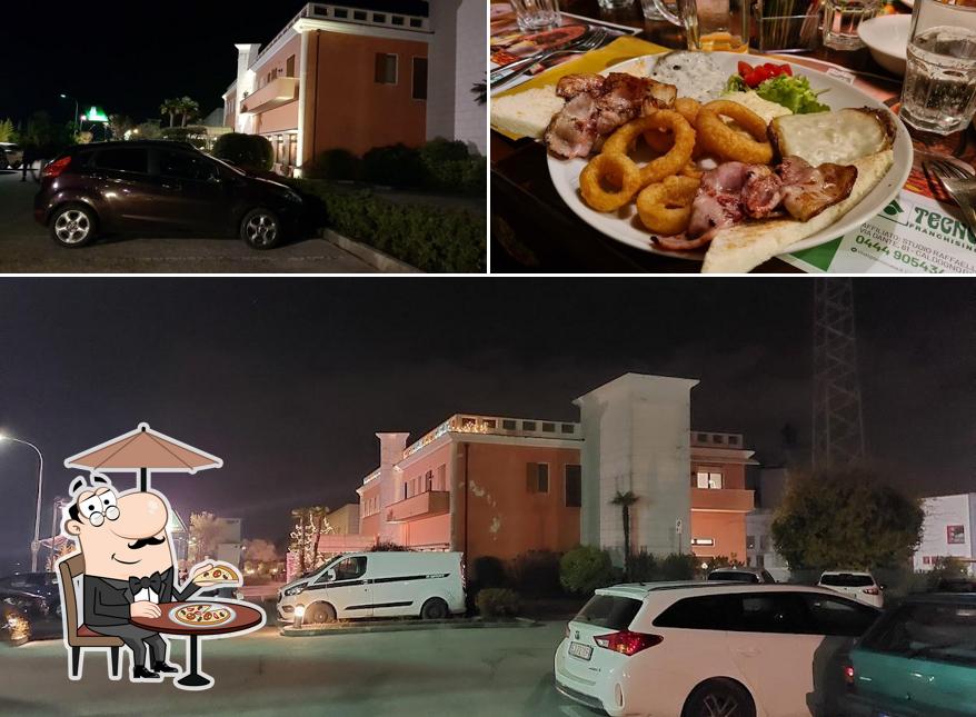 La immagine della esterno e cibo di Pizzeria Birreria Le Due Torri