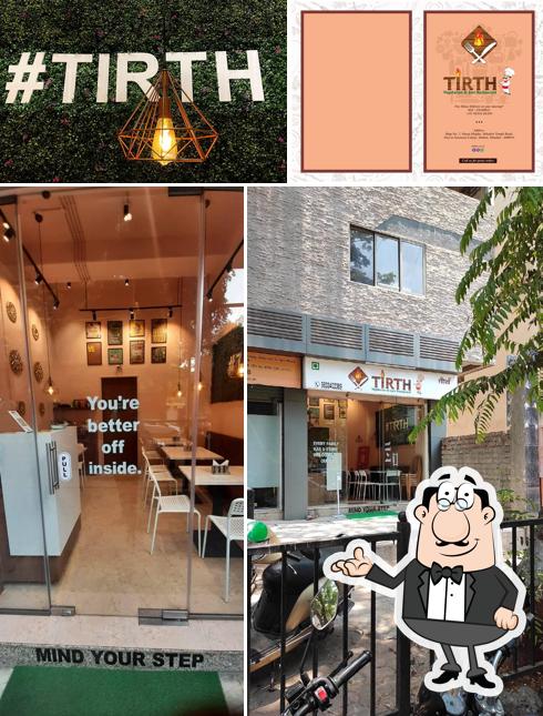 Take a seat at one of the tables at Tirth Vegetarian & Jain Restaurant