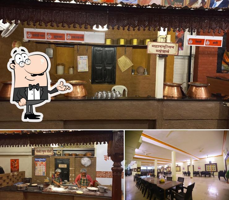 Take a seat at one of the tables at Vishnuji Ki Rasoi, Amravati