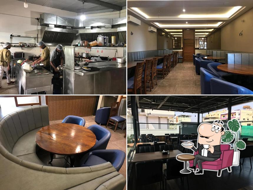 Take a seat at one of the tables at सेवन वेळास फैमिली रेस्टो बार