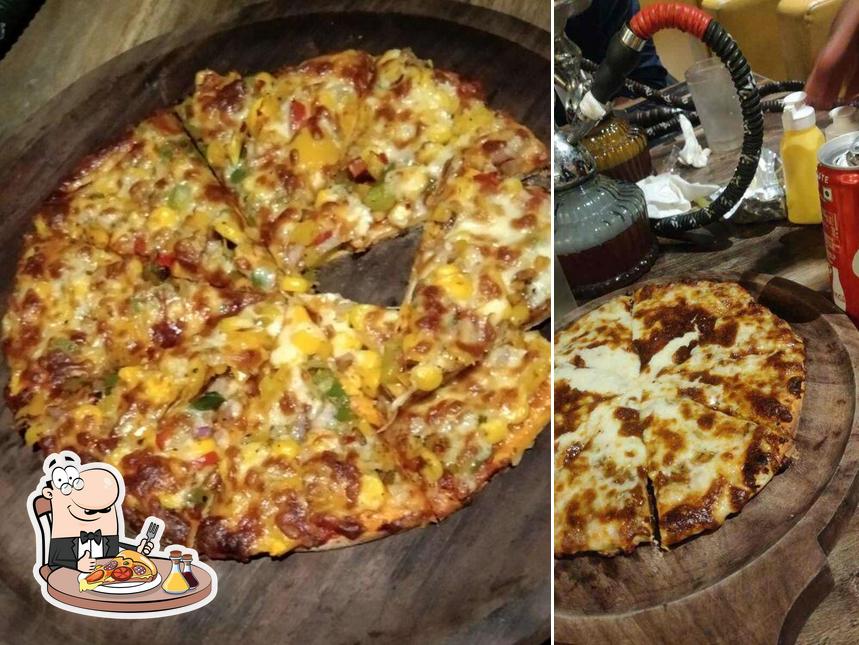 Try out pizza at SKYFALL LOUNGE