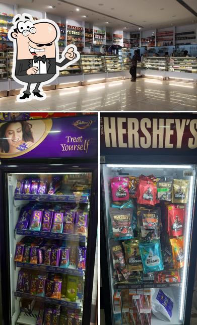 Take a seat at one of the tables at Alankar Sweets & Bakers