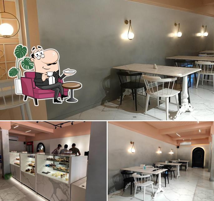 Take a seat at one of the tables at Little_H True Cakes & Desserts