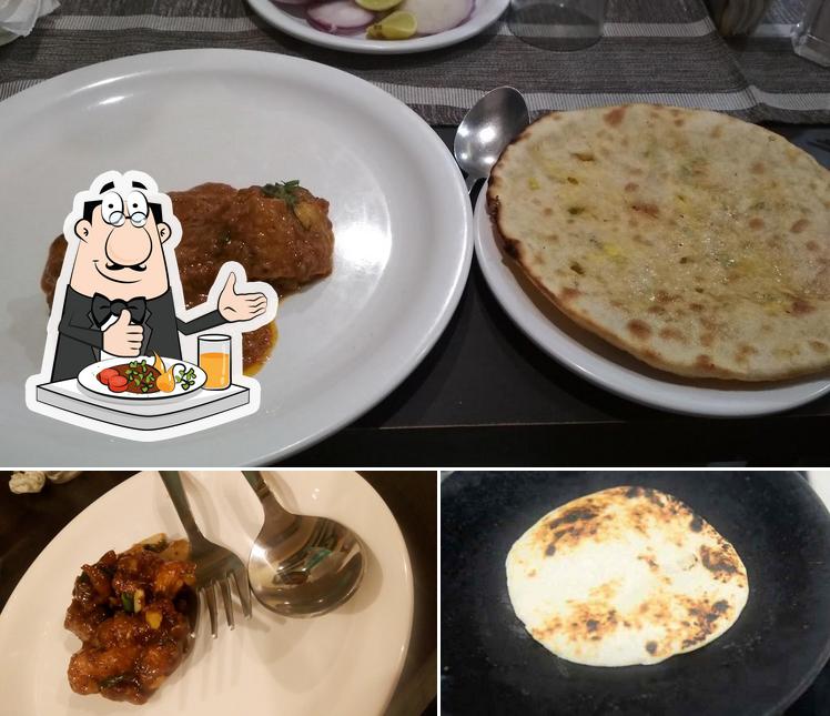The picture of food and exterior at Saurabh Family Hotel Premium Rooms and Restaurant