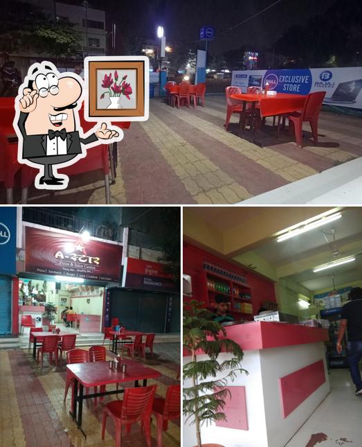 Take a seat at one of the tables at A Star Pizza & Juice Centre