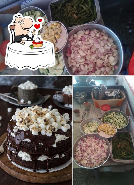 Vishnu Daba Rajpurohit serves a selection of sweet dishes