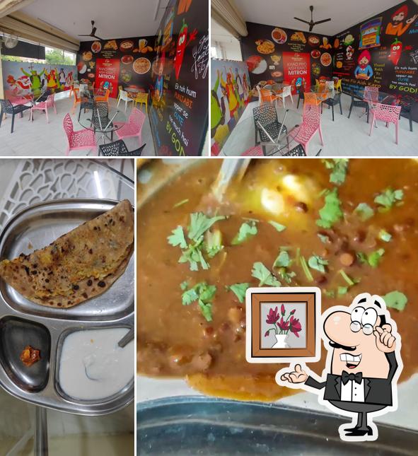 The photo of interior and food at Sharma Punjabi Hotel