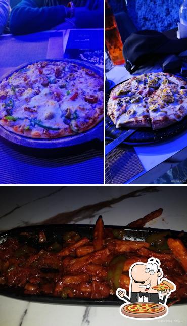 Get pizza at The Marine Vibe - Best Family Restaurants in Rohtak, Best Party Hall in Rohtak, Best Vegetarian Restaurants in Rohtak