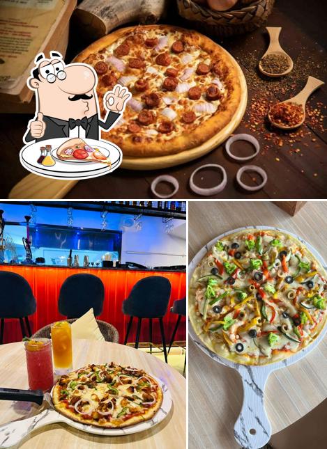 Get pizza at Aabu's Bar & cafe
