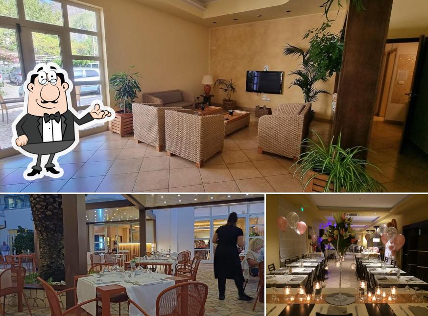 La foto della interni e tavolo da pranzo di Garden Restaurant Praia