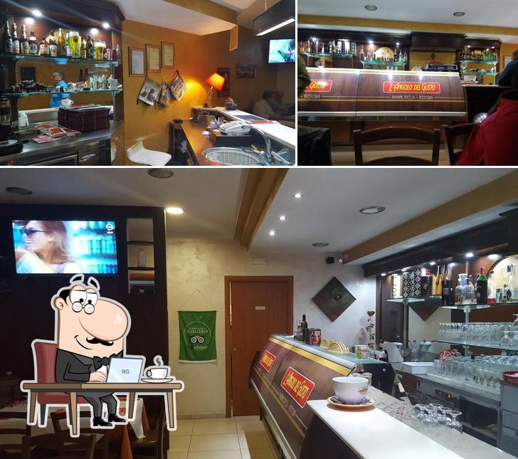 La foto di interni e bancone da bar da L'Angolo del Gusto