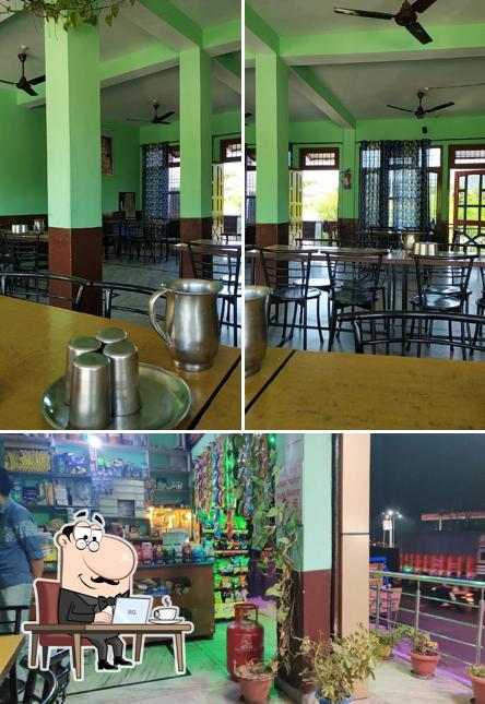 Take a seat at one of the tables at Sharma Home Stay and Foods