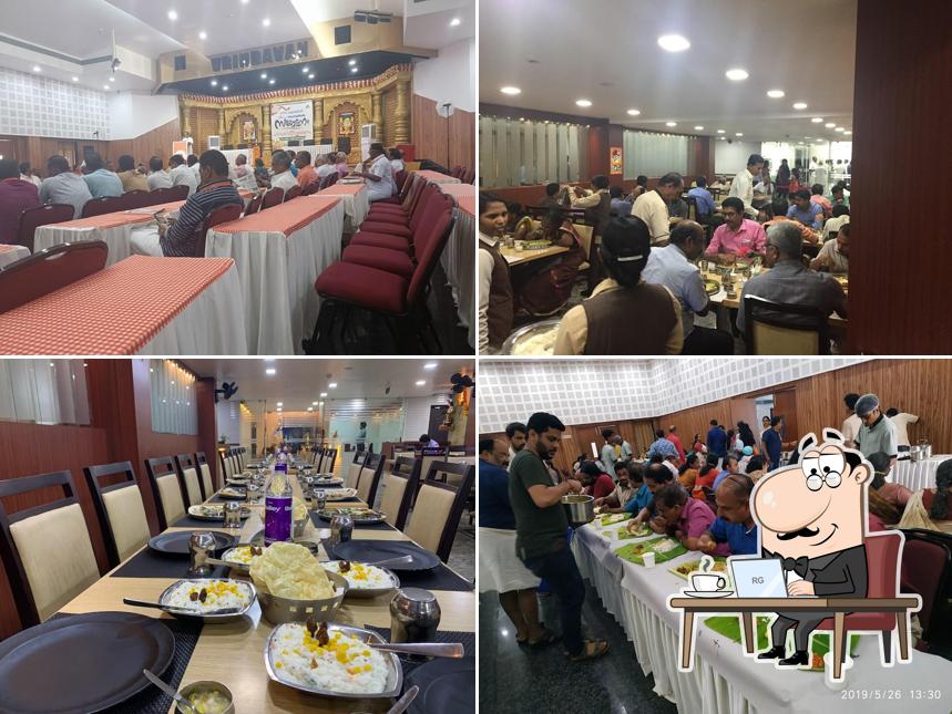 Take a seat at one of the tables at Vrindavan Inn