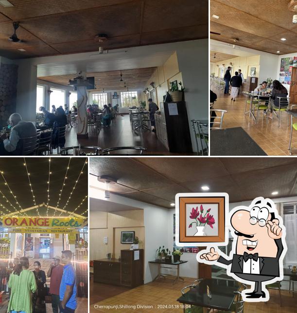 The interior of Orange Roots, Pure Veg Restaurant