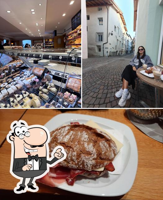 Dai un’occhiata alla foto che mostra la interni e cibo di Gasser