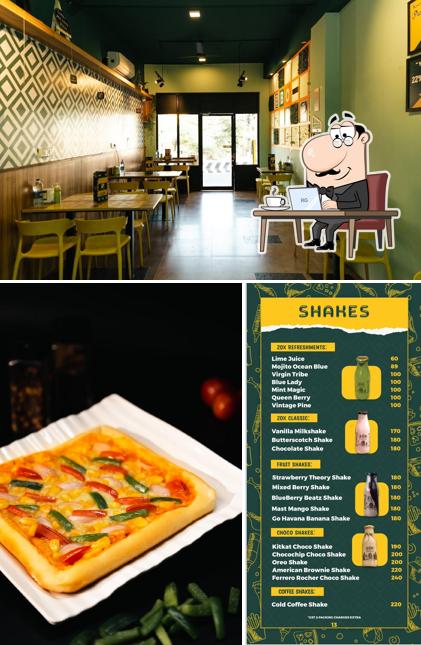 Take a seat at one of the tables at BOCS Pizza Trichy பாக்ஸ் பீட்ஸா, திருச்சி