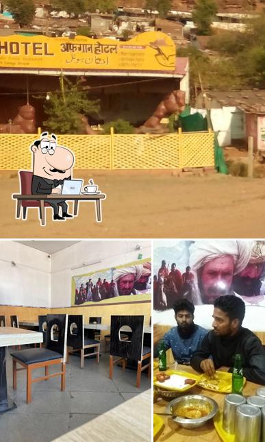 Take a seat at one of the tables at Afghan Hotel