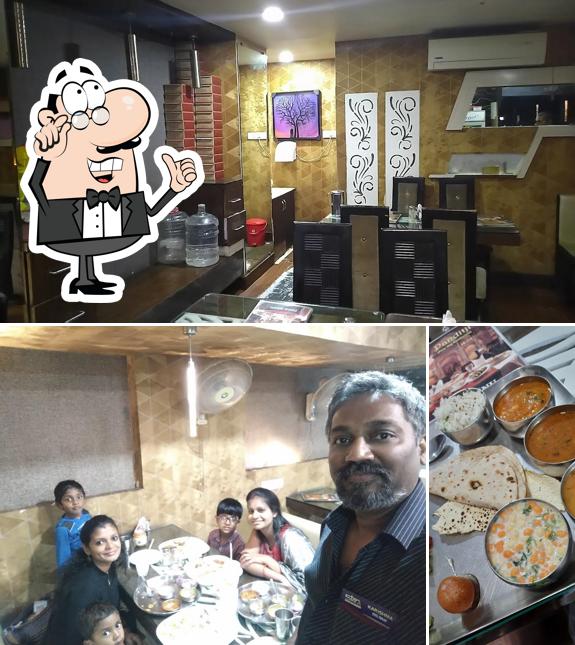 Take a seat at one of the tables at Panditji Pure Veg. Restaurant