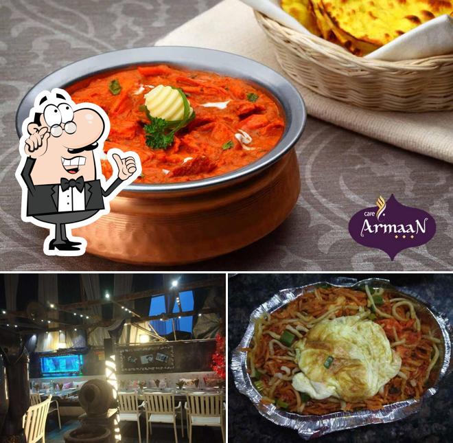 Check out the photo showing interior and food at Cafe Armaan