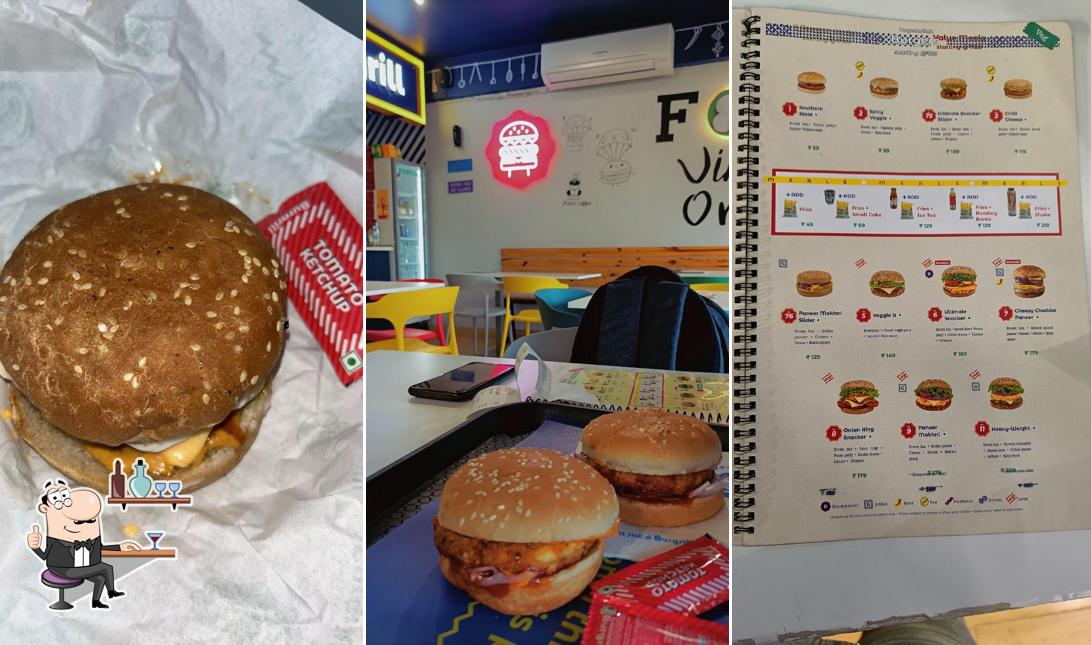 Take a seat at one of the tables at Burgrill Lal Ghati - Best Burgers from Delhi