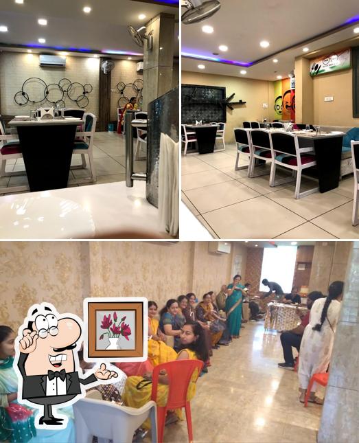 Take a seat at one of the tables at Khaanpaan Restaurant