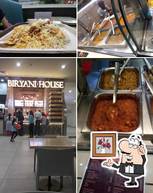 Take a seat at one of the tables at Biryani House
