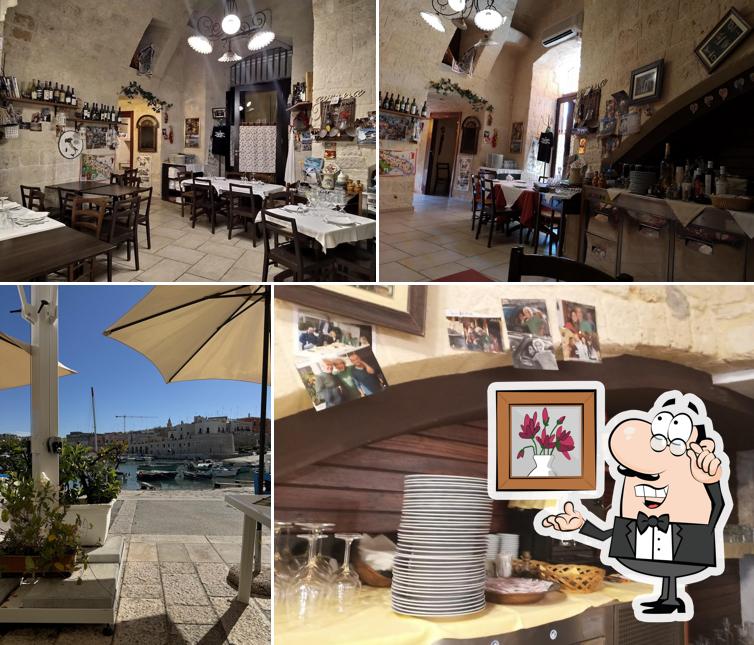 Dai un'occhiata agli interni di Osteria Del Porto Juan Les Pins