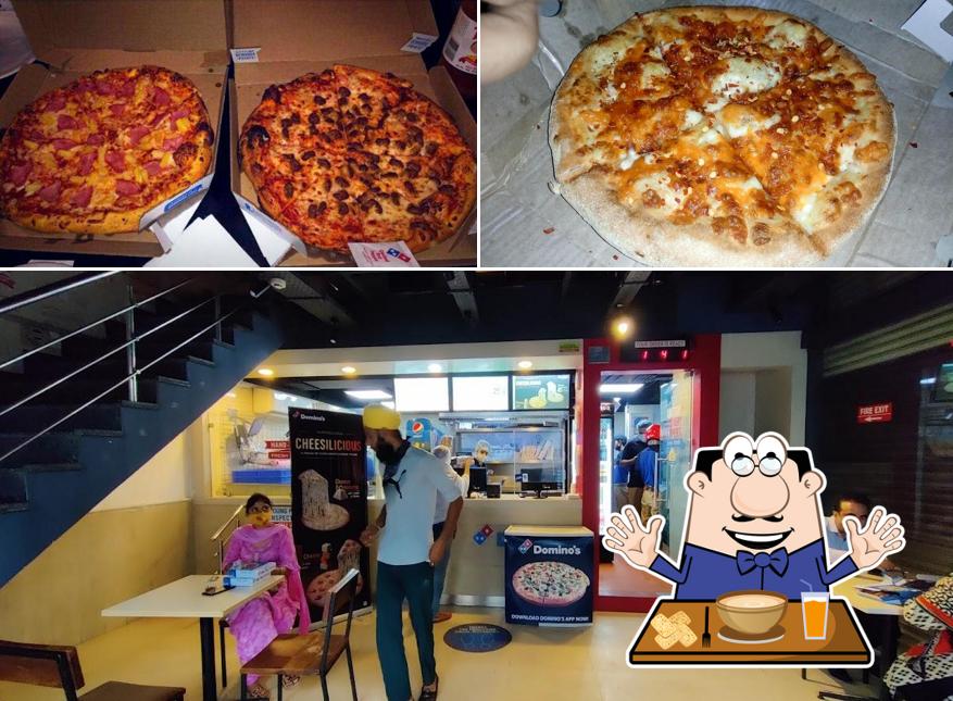 Check out the image depicting food and interior at Domino's Pizza