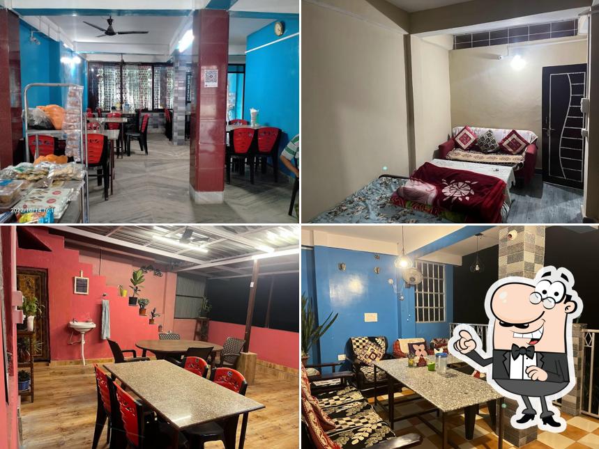 Take a seat at one of the tables at PRADHAN HOTEL, (Resturant & Home stay)- Melli Bazzar, NH10
