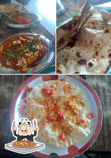 Get pizza at Hotel Sai Jatra