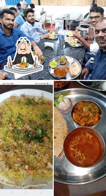 Take a look at the image depicting food and interior at Jai Malhar Bhojnalya