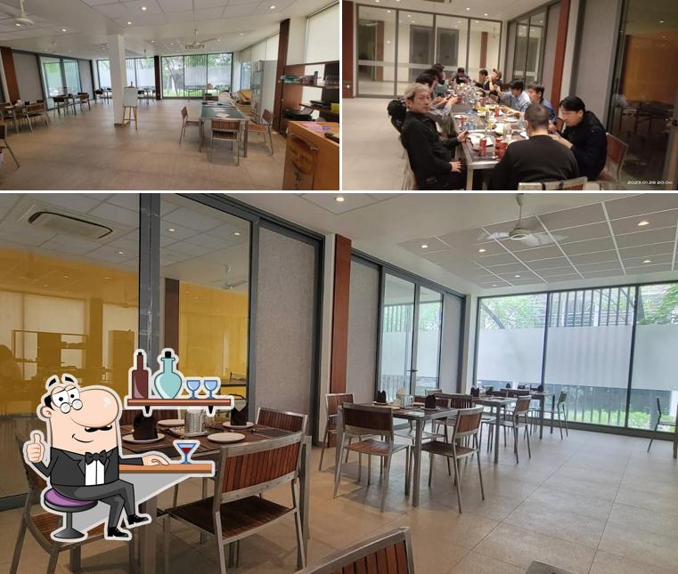 Take a seat at one of the tables at ASAGAO BY YUHI - THE JAPANESE RESTAURANT