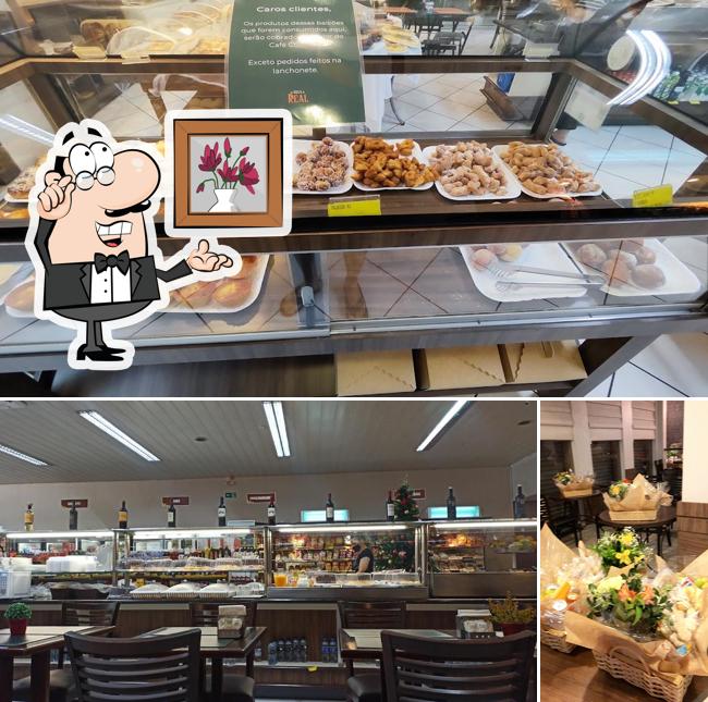 Sente em uma das mesas no Panificadora Nova Real