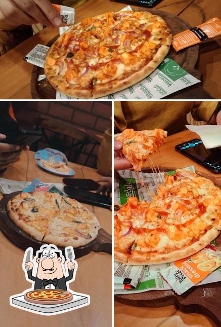 Try out pizza at Urbane Cafe