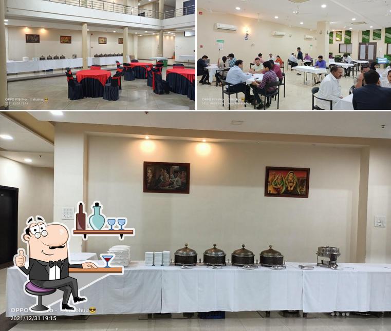 Take a seat at one of the tables at Hotel Radhe