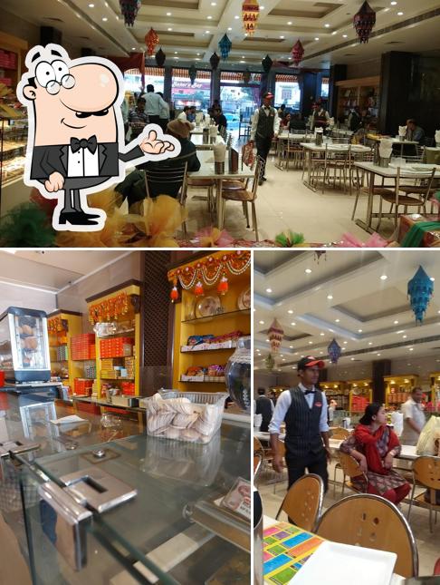 Take a seat at one of the tables at Gulab Sweets & Restaurant -Best Sweet Shop in Rohtak Best Restaurent & Sweet Shop Famous Sweet Shop in Rohtak