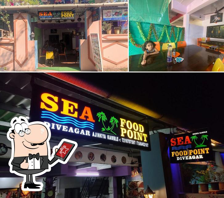 The image of Sea Food Point Restaurants’s exterior and dining table