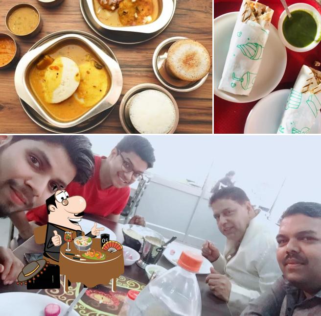 Among different things one can find food and dining table at Swami Dhaba