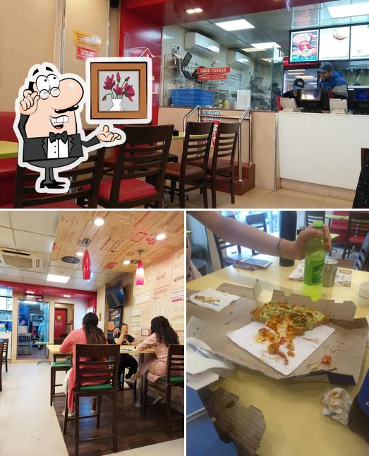 Take a seat at one of the tables at Domino's Pizza City Centre, Rishikesh