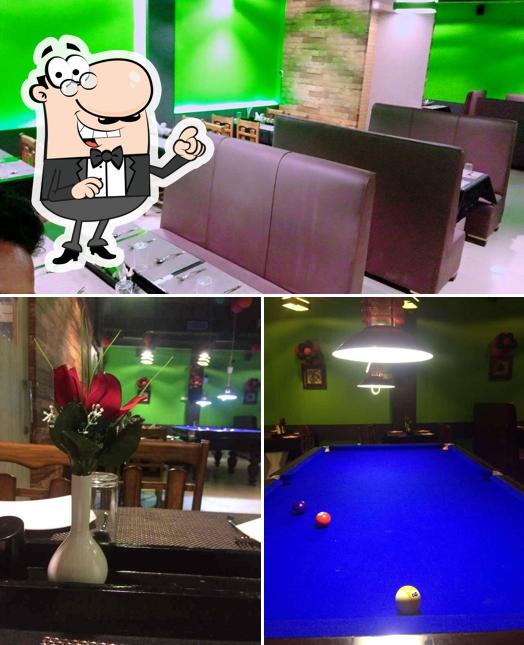 Take a seat at one of the tables at Cuisinic Salad & Restaurant