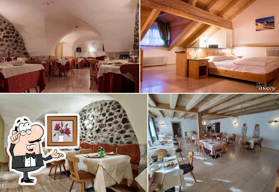 Siediti a un tavolo di Garnì Ristorante Pizzeria Casa Moresc