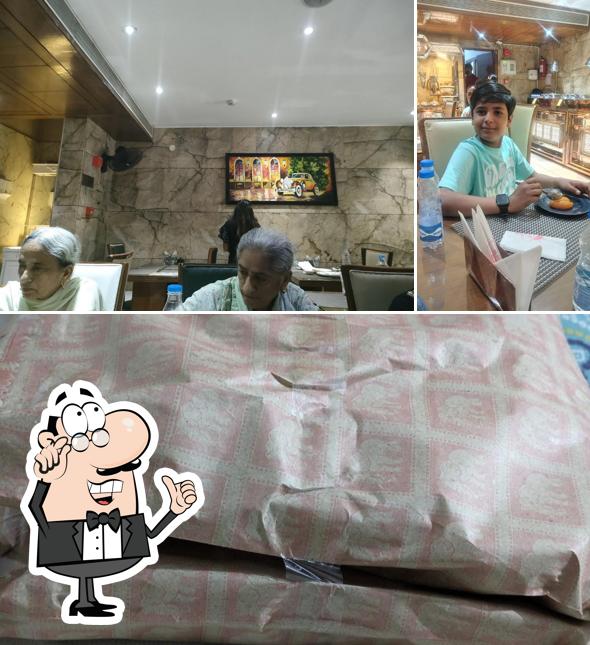 Take a seat at one of the tables at Brar Buffet and Dhaba