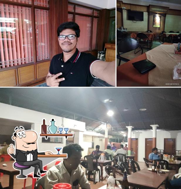 Take a seat at one of the tables at Cherakulam Tourist Home