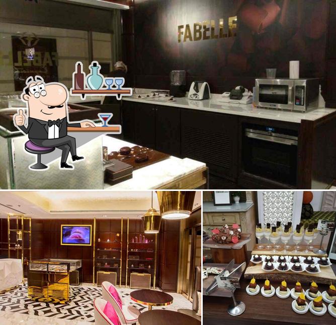 Take a seat at one of the tables at Fabelle Chocolates - ITC Maratha