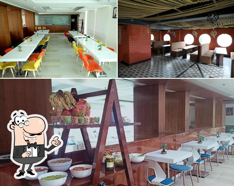 Take a seat at one of the tables at Krishna Valley Wellness Resort Vrindavan