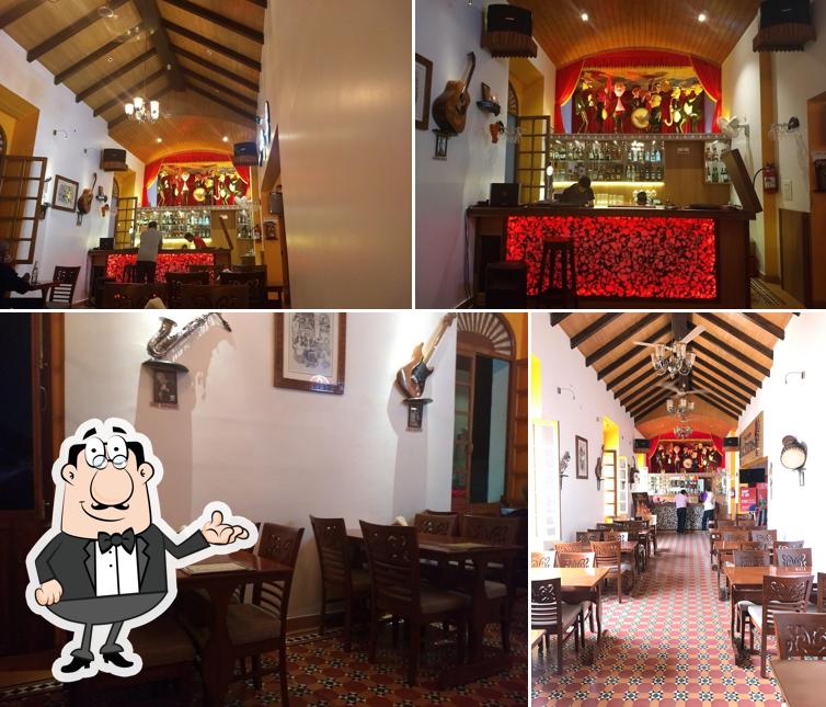 This is the picture displaying interior and bar counter at Clube National Restaurant