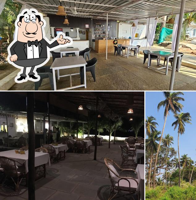 Take a seat at one of the tables at Uddo Life Sunset Bar & Kitchen