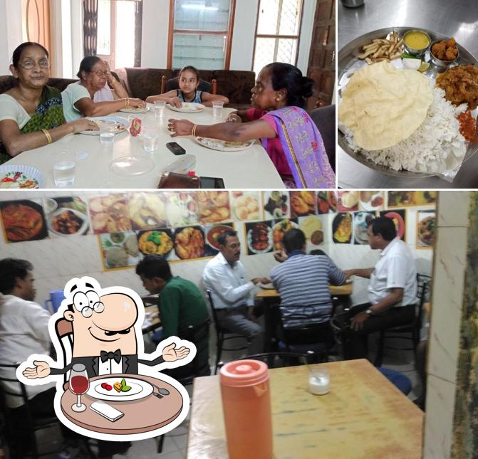 Among different things one can find dining table and dessert at New Bengali Mess